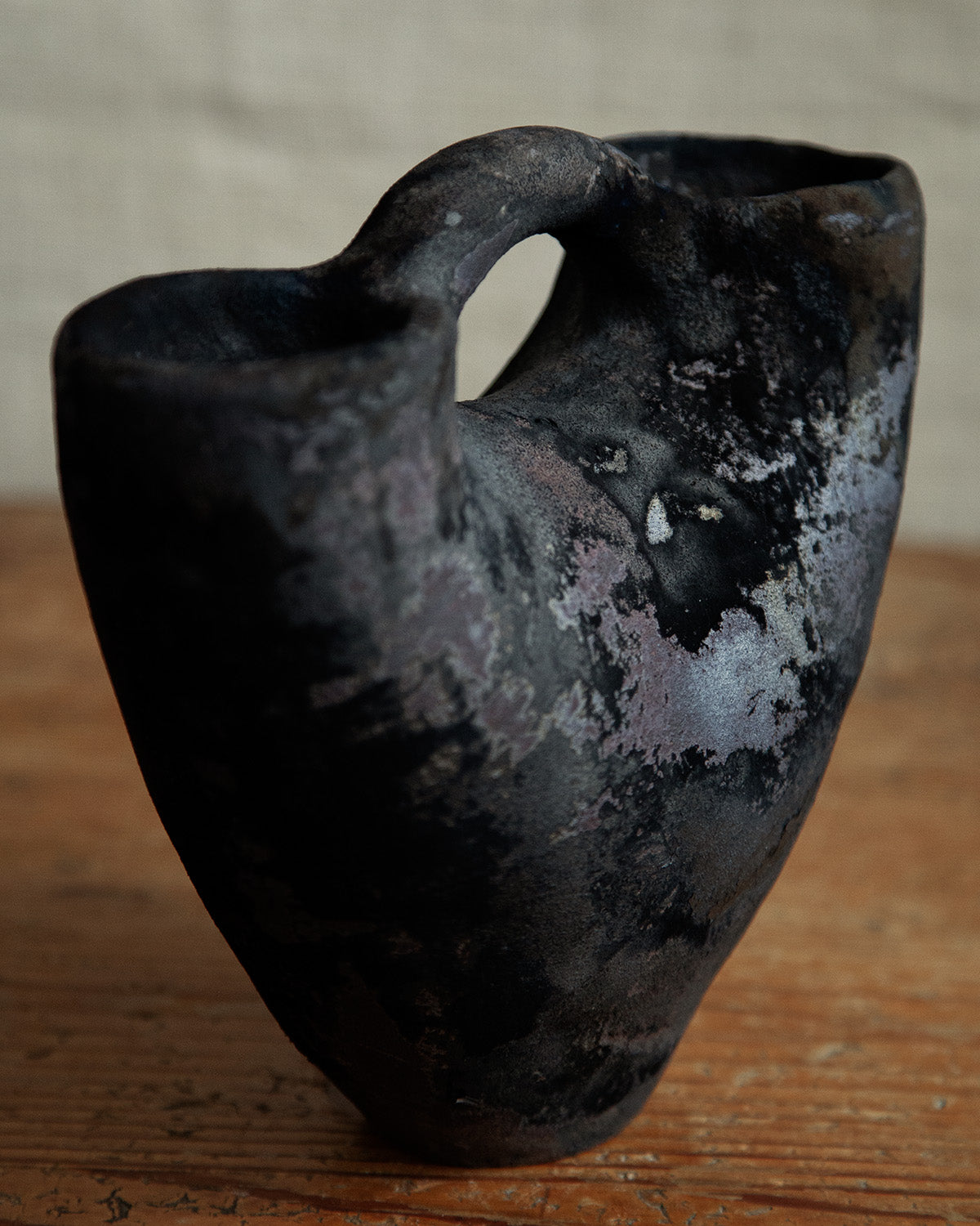 double mouthed vessel with handle, in Black Velvet Raku