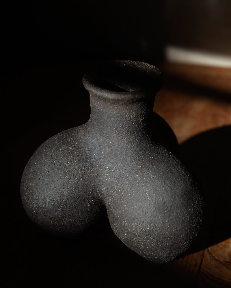 Tripod vessel in black textured stoneware #1